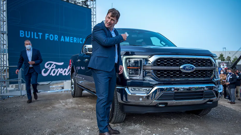 Jim Farley leaning on Ford truck