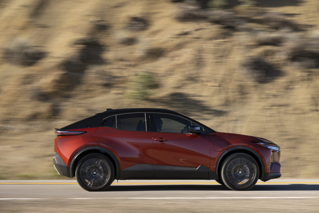 A red Toyota C-HR in profile