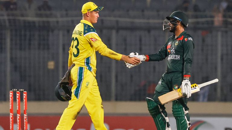Mehidy Hasan Miraz (right) shakes hands with Australia's Marnus Labuschagne (left)