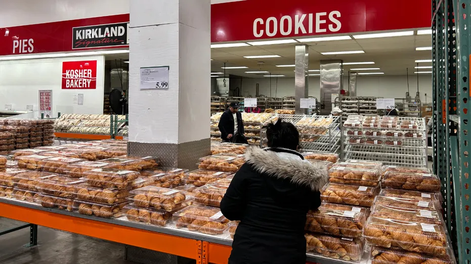 Costco bakery with woman shopping.