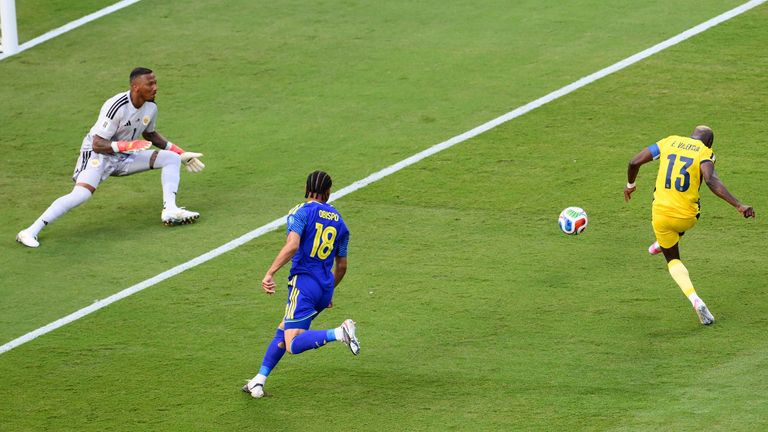 Ecuador's Enner Valencia (13) shoots at goal as Cura..ao goalkeeper Eloy Room (1) defends during the World Cup Group E 