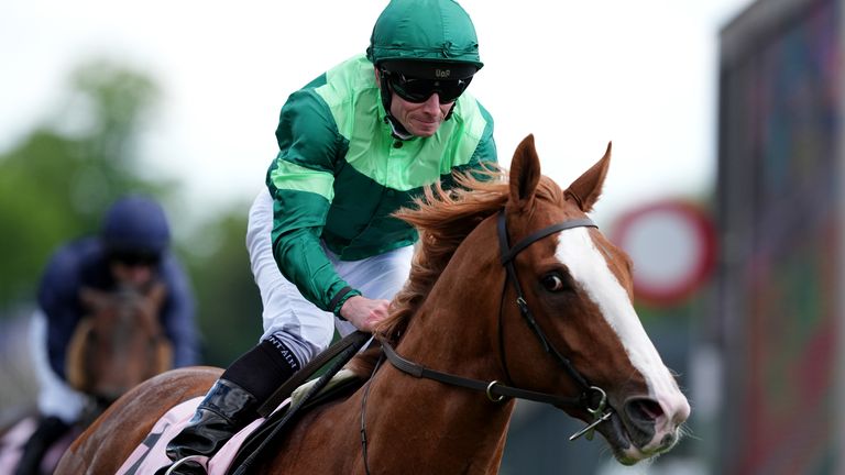 Benvenuto Cellini and jockey Ryan Moore