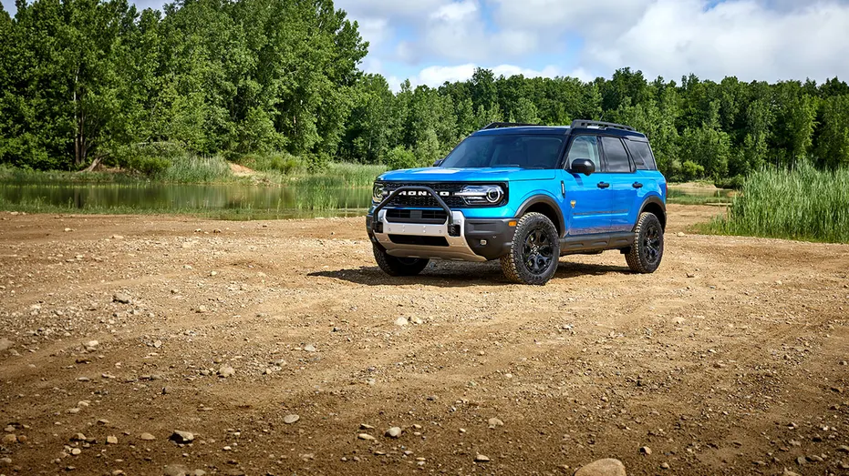A Ford Bronco Sport outside in a forest.