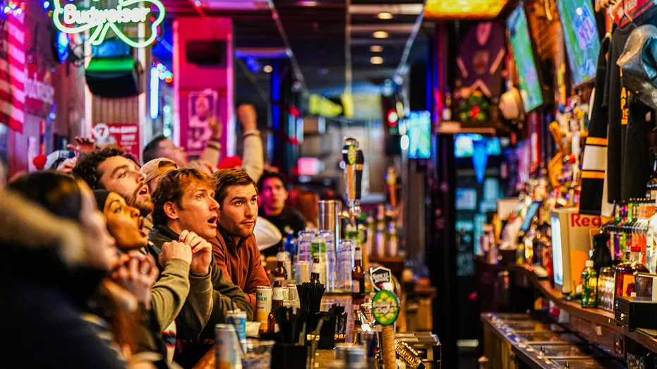 Sports fan watch the Superbowl at bar