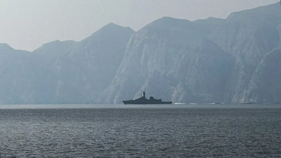 A navy vessel is seen sailing in the Strait of Hormuz