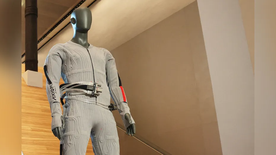 gray spacesuit lining on manequin 