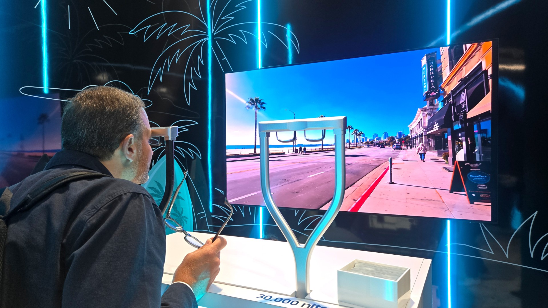 A man experiencing a smart glasses demo powered by Samsung Display&rsquo;s RGB OLEDoS at AWE USA 2026