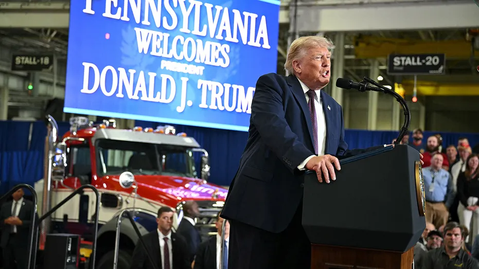Donald Trump speaks at a Mack Trucks facility