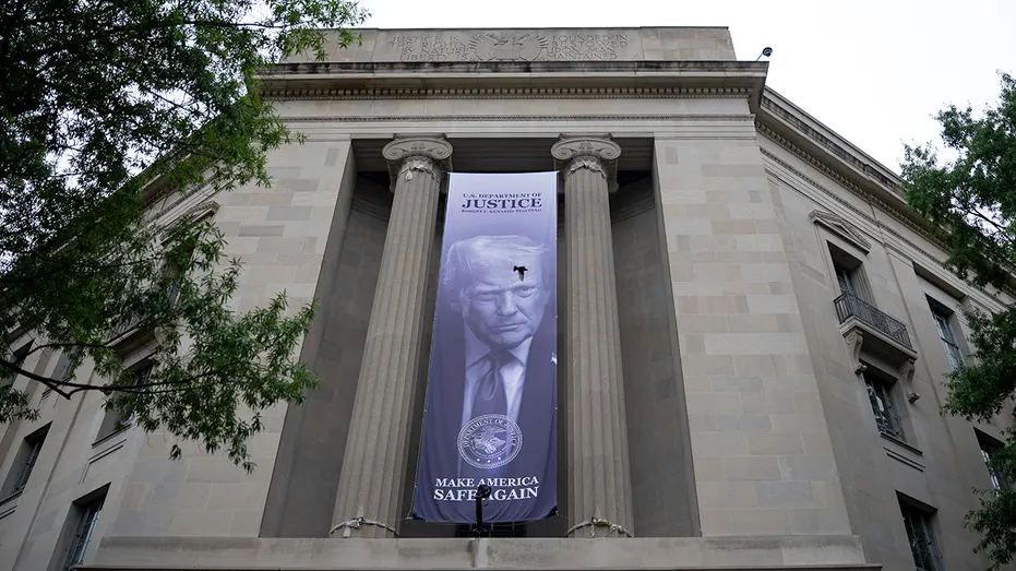 Banner featuring Trump hangs on DOJ headquarters
