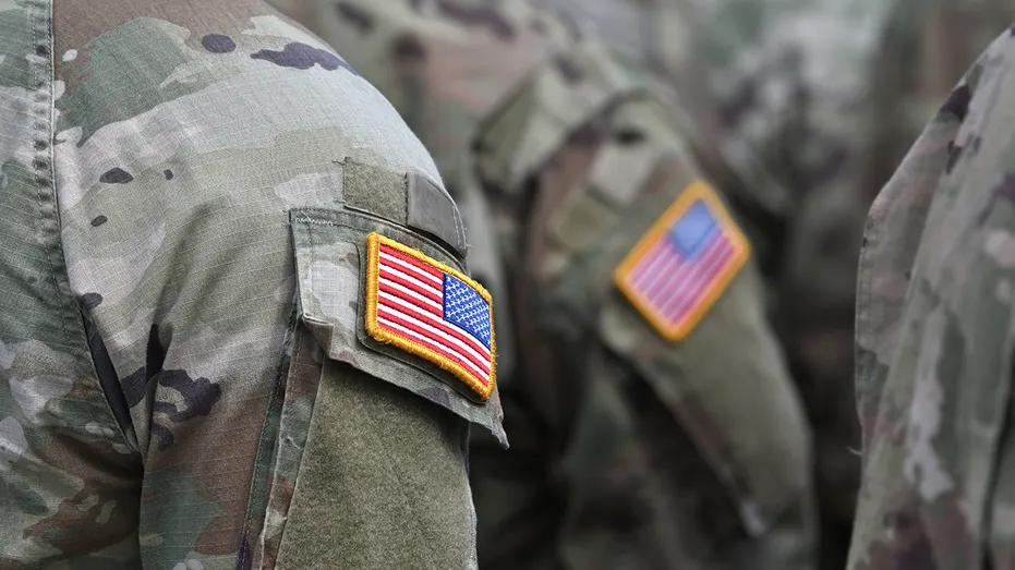 U.S. service members stand in uniform. Many veterans, active-duty service members and military families remain unfamiliar with VA-backed home loan benefits, according to a Rocket Mortgage survey.