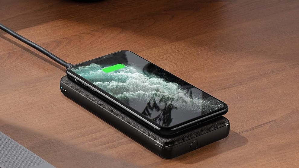 An iPhone on the Anker PowerCore III Wireless Portable Charger