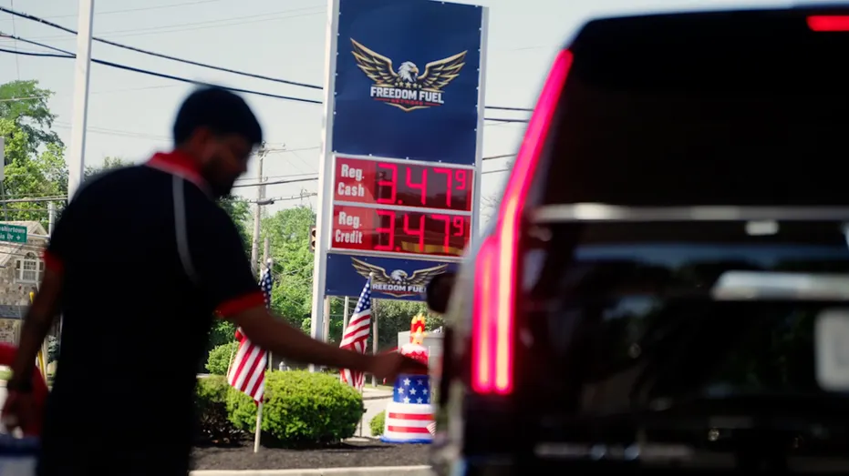 Gas price billboard by car