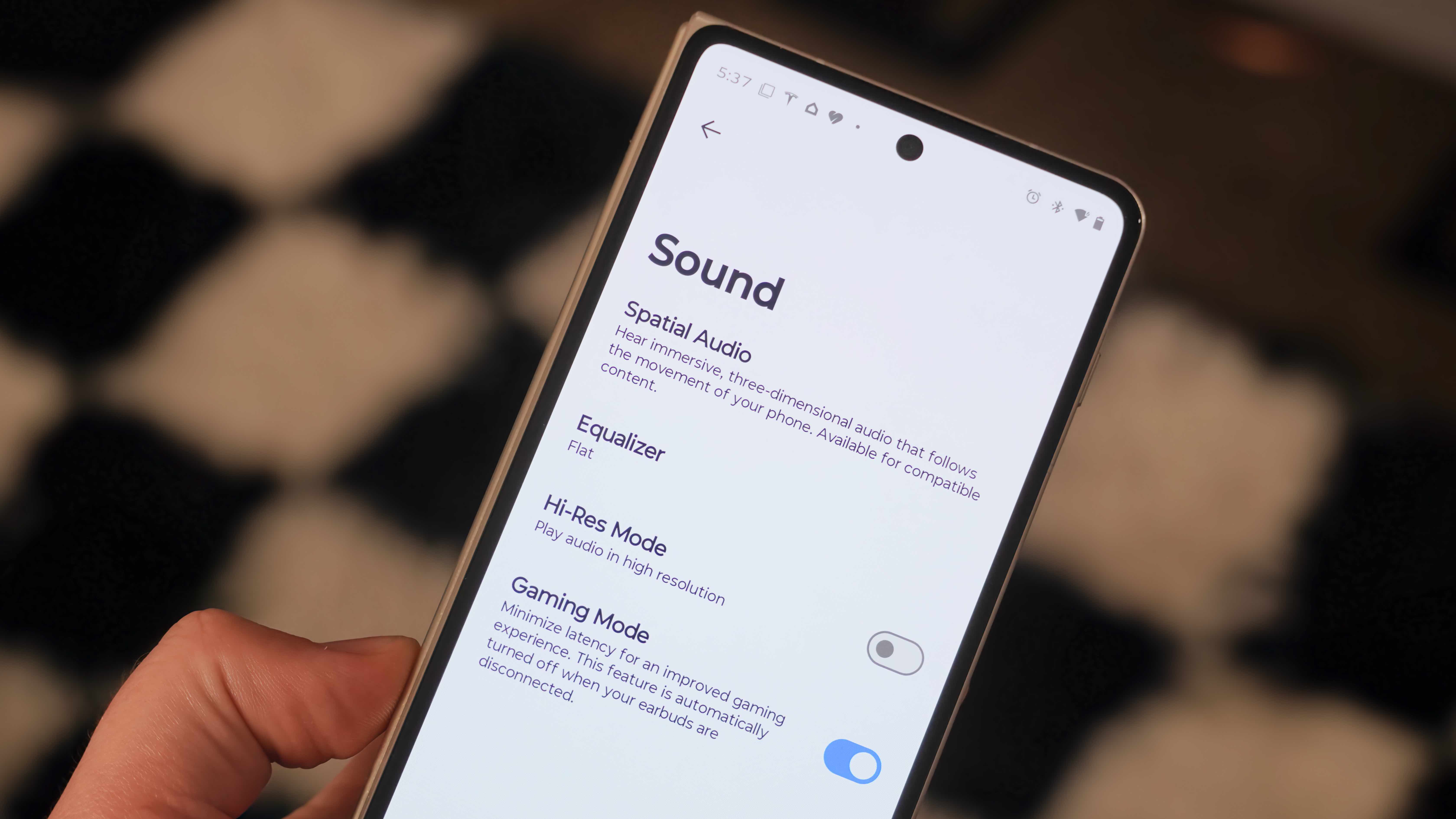 The Moto Buds 2 Plus alongside their companion app showing settings to change to improve audio quality.