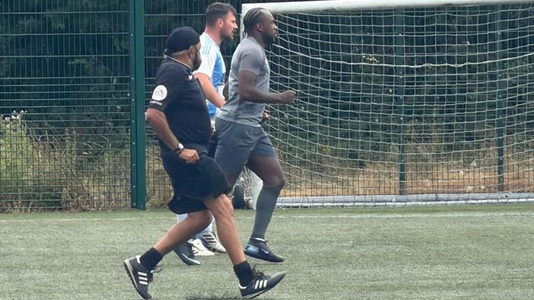 Michail Antonio and an opposition player are tracked by referee Jarnail Singh at KFF tournament Leicester