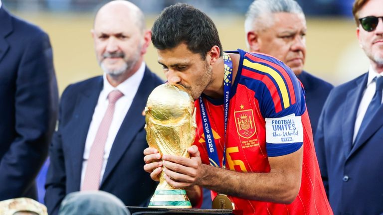 Rodri of Spain kisses the 2026 FIFA World Cup trophy