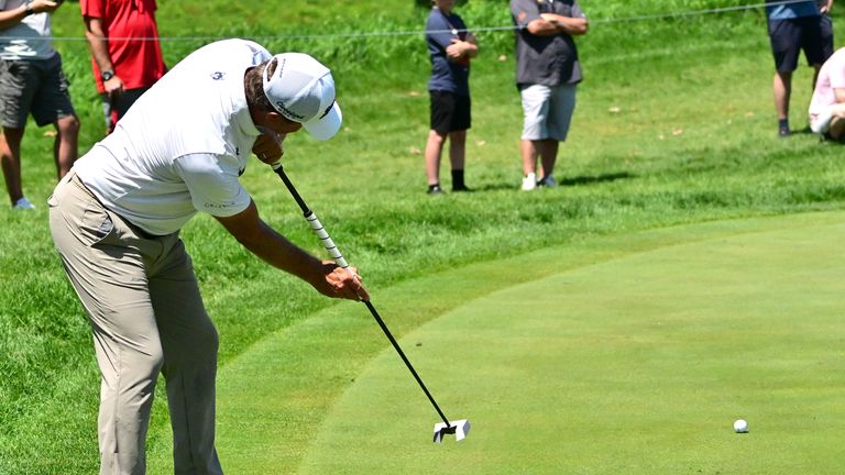 Lucas Glover took his shoes off on the green at the 3M Open