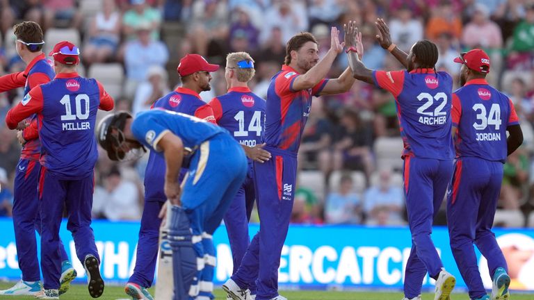 Southern Brave team members celebrate the wicket of MI London's James Vince