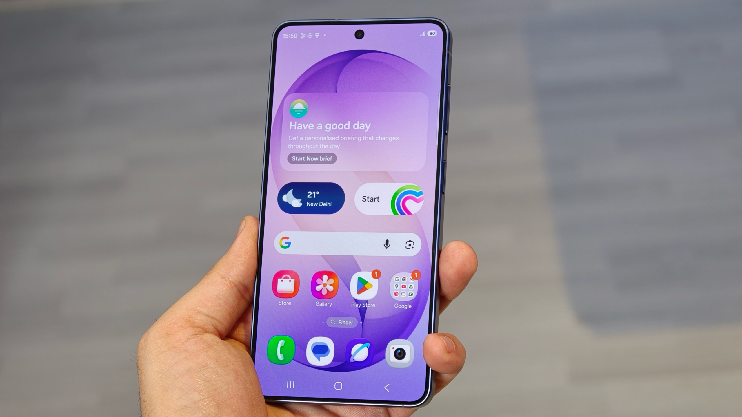 Samsung Galaxy S26 with its display turned on and showing the One UI 8.5 home screen