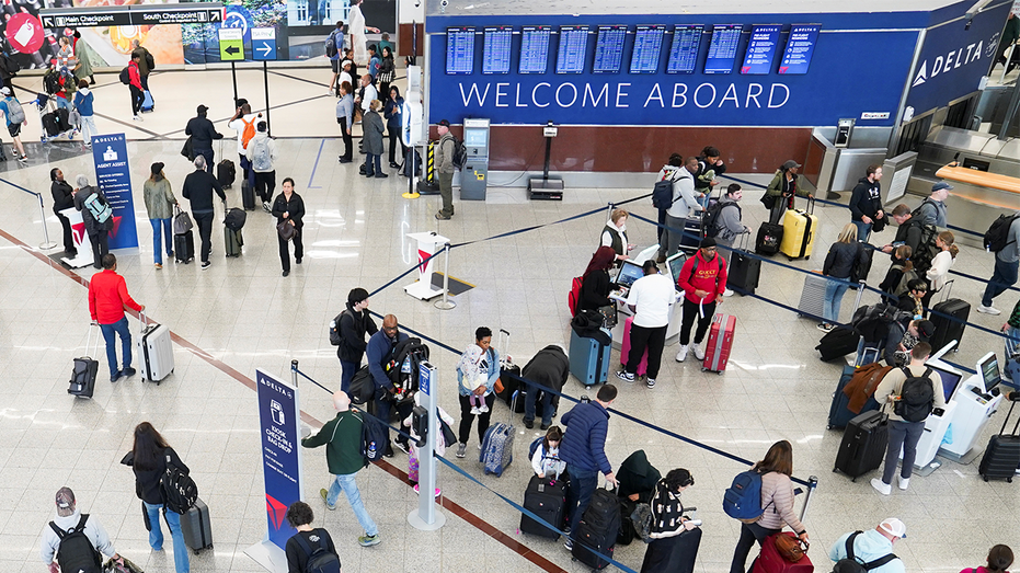 People walk around the airport