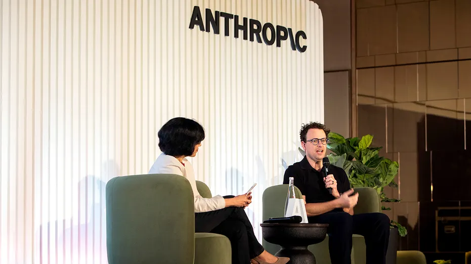 Anthropic CEO Dario Amodei, at right.