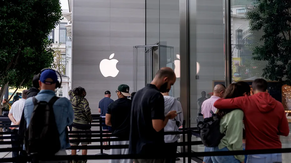 Customers wait outside Apple store in Los Angeles
