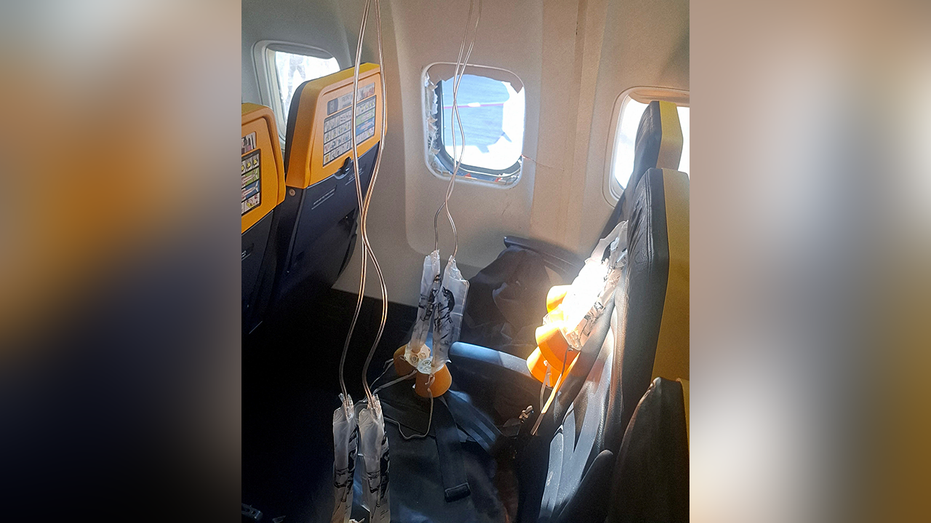 A broken window and the interior of the Ryanair aircraft