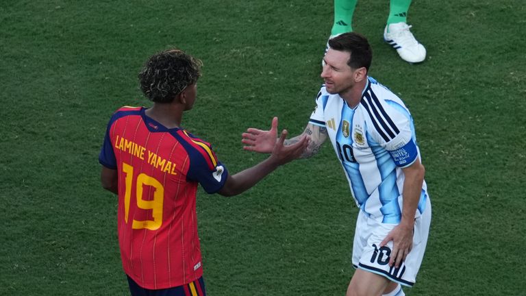 Lamine Yamal and Lionel Messi embrace after the World Cup final