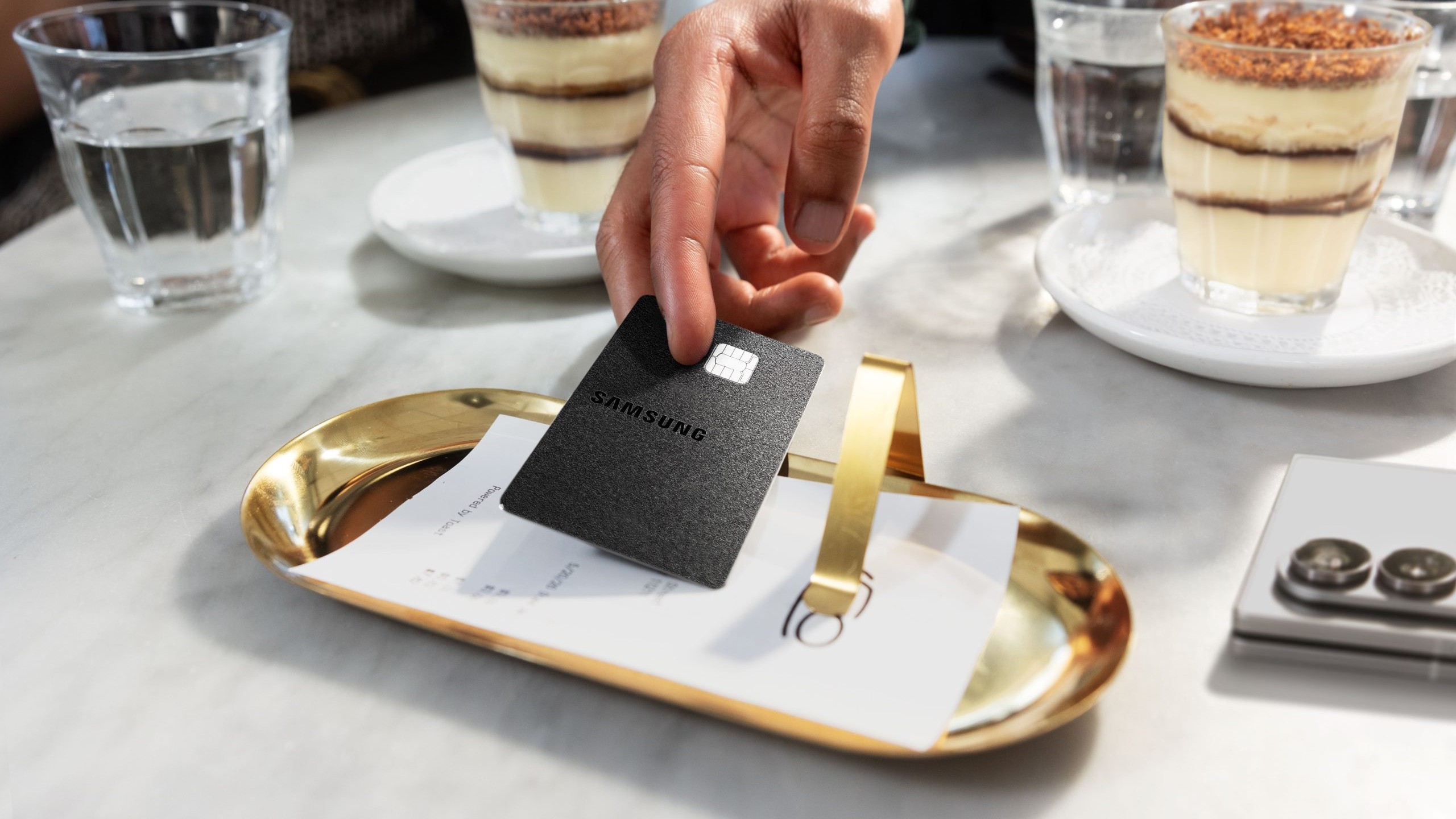 The Samsung Galaxy Card in black metal.