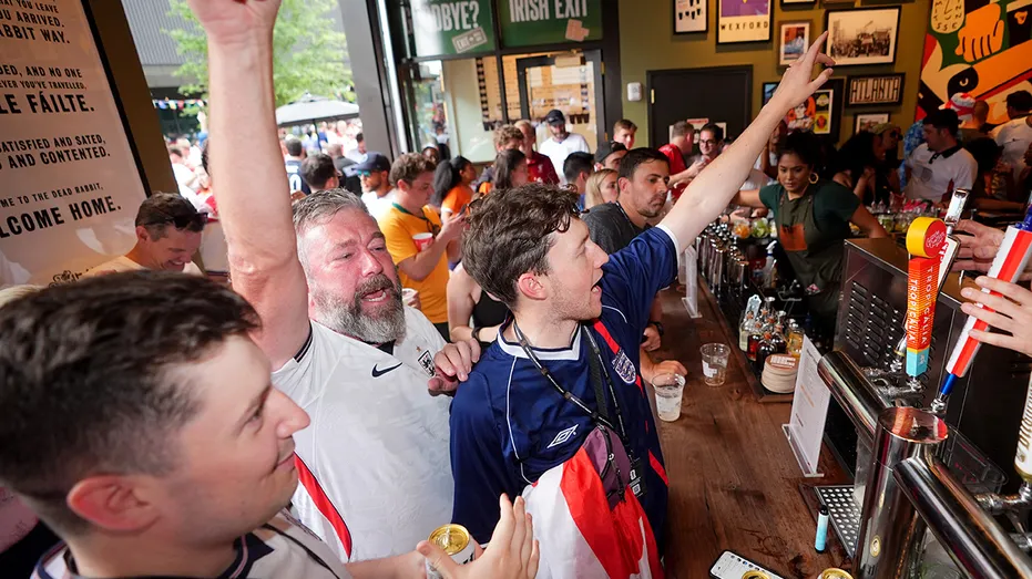 England fans celebrate a goal at an Atlanta bar