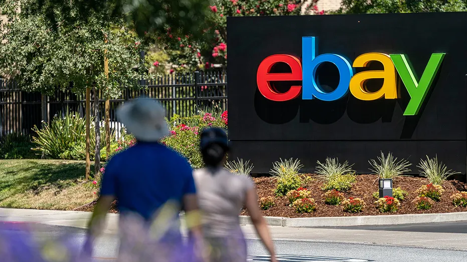 People walk by eBay headquarters