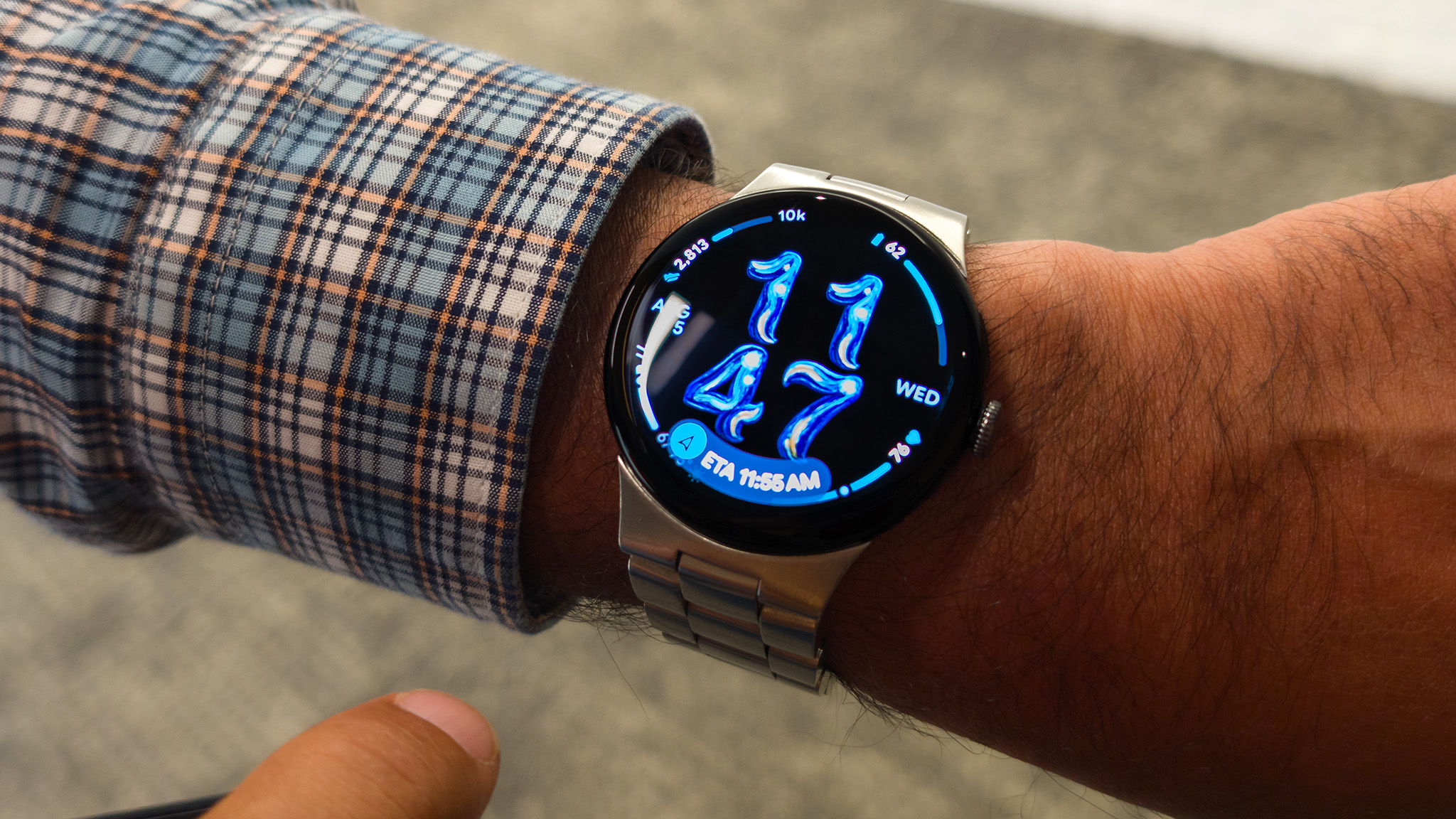 The At a Glance feature on the Google Pixel Watch 5, showing the current Google Maps route ETA