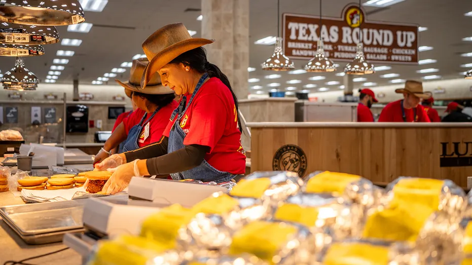 Employees prepare brisket offerings inside Buc-ee's in Luling, Texas.