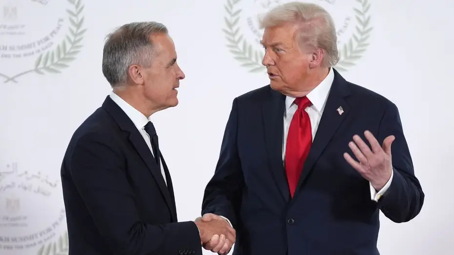 Donald Trump shakes hands with Canadian Prime Minister Mark Carney during summit in Egypt