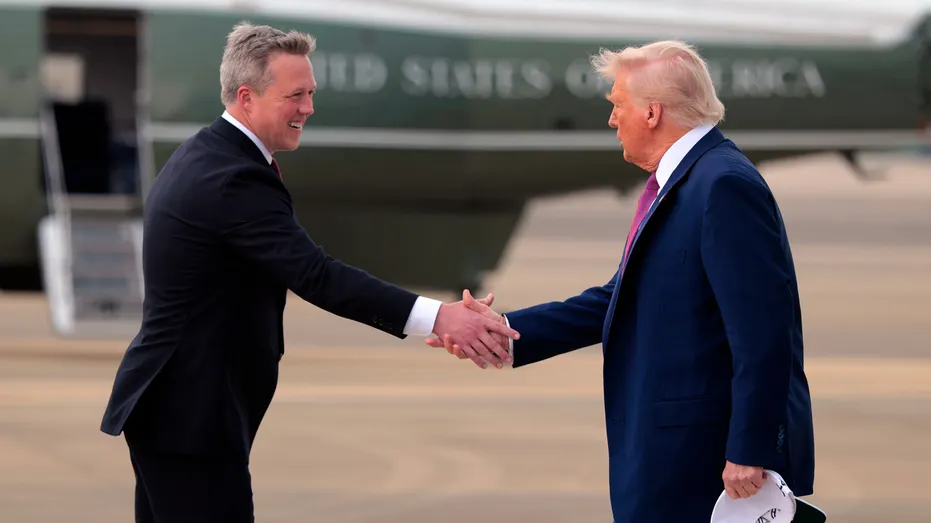 President Donald Trump and Army Secretary Dan Driscoll