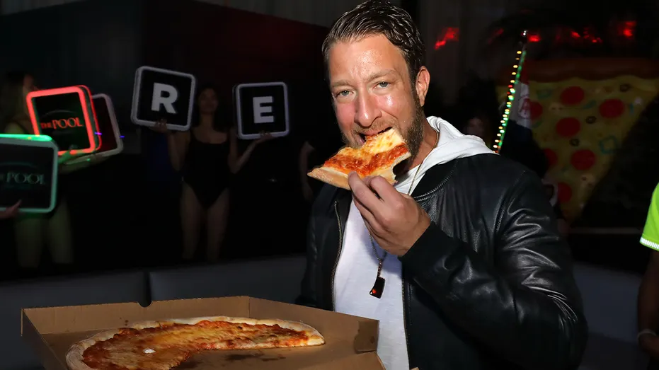 Dave Portnoy takes bite of pizza