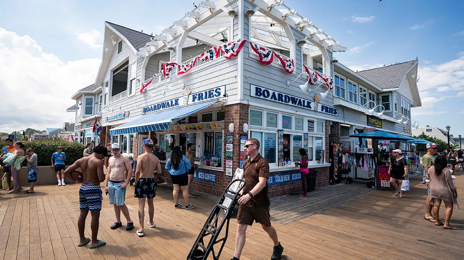 People on a beach town boardwalk