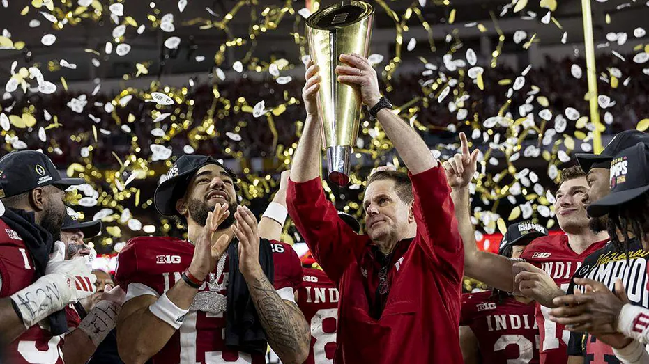 Indiana head coach Curt Cignetti celebrates a national title