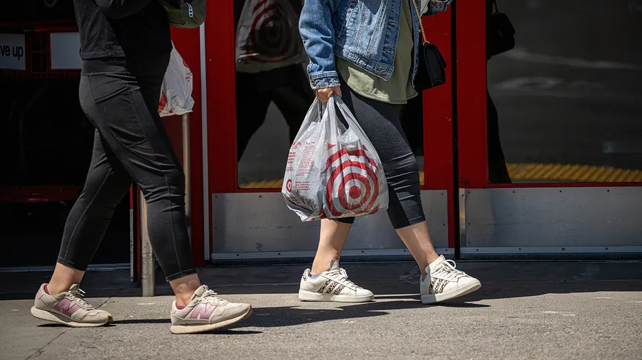 Target customers walk out with bags in hand