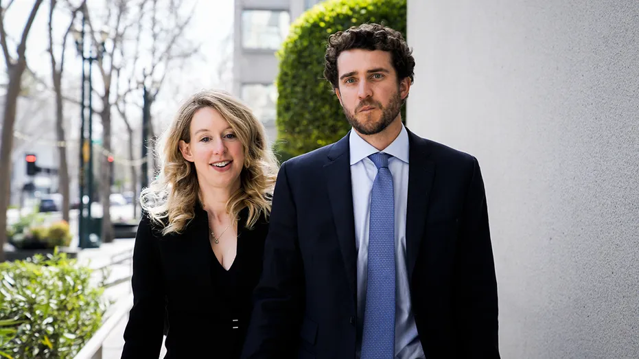 Former Theranos CEO Elizabeth Holmes alongside her boyfriend Billy Evans
