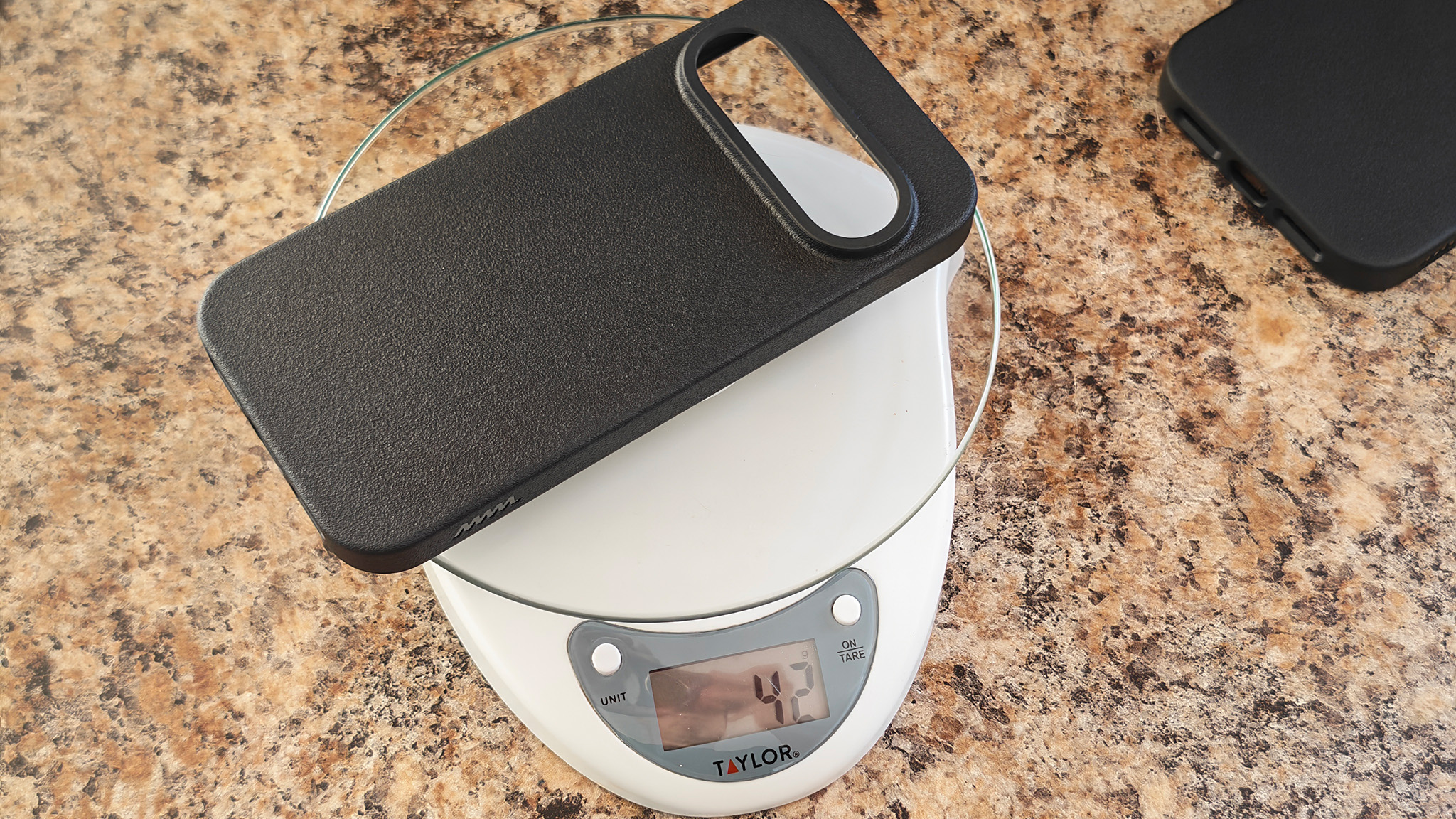 Weighing a Dbrand MNML case for the Pixel 11 Pro