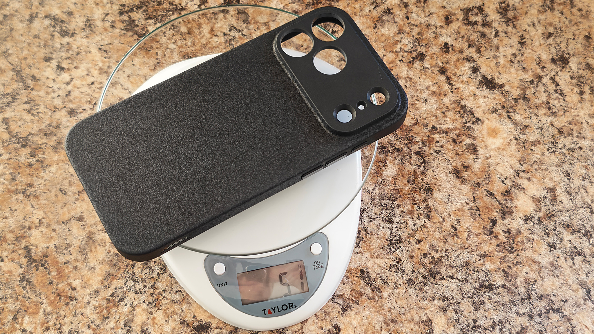 Weighing a Dbrand MNML case for the iPhone 17 Pro Max