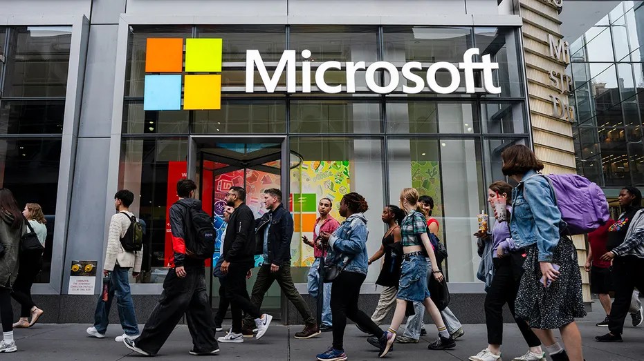 People walk by the Microsoft Office