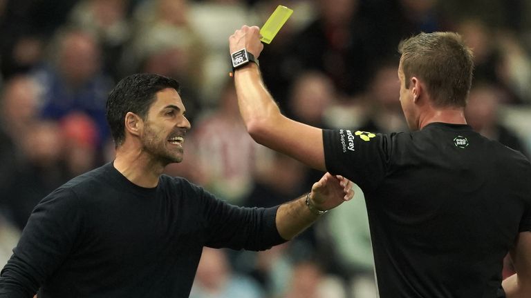 Arsenal boss Mikel Arteta (left) was shown a yellow card in their win at Sunderland