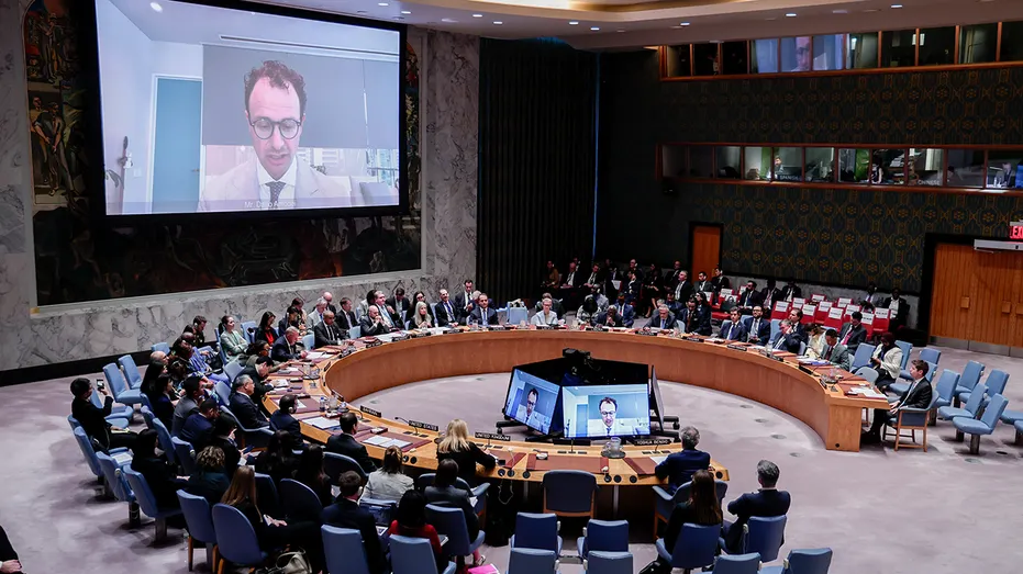 Dario Amodei, co-founder and chief executive officer of Anthropic, on screen, speaks virtually at a United Nations Security Council meeting