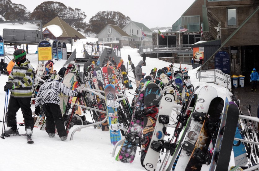 People getting ready to ski and snowboard at Perisher Valley