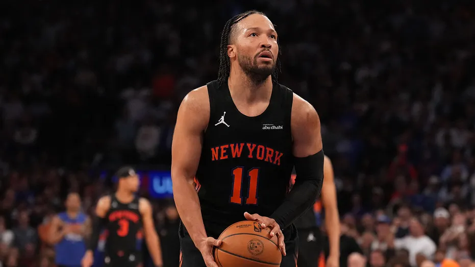Jalen Brunson looks on court