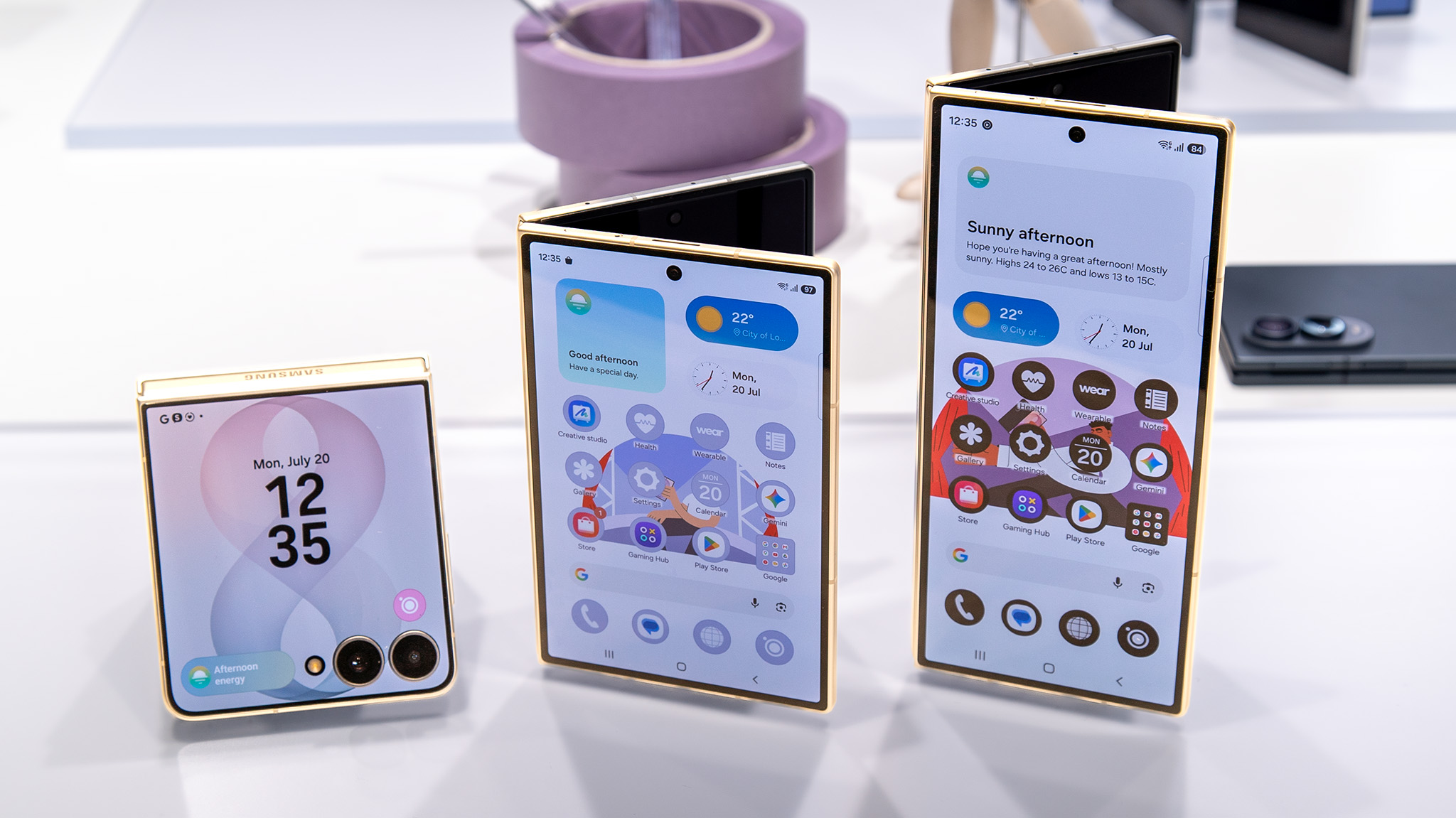 Comparing the sizes of the Samsung Galaxy Z Flip 8 (pink) with the white Galaxy Z Fold 8 Ultra and grey Galaxy Z Fold 8