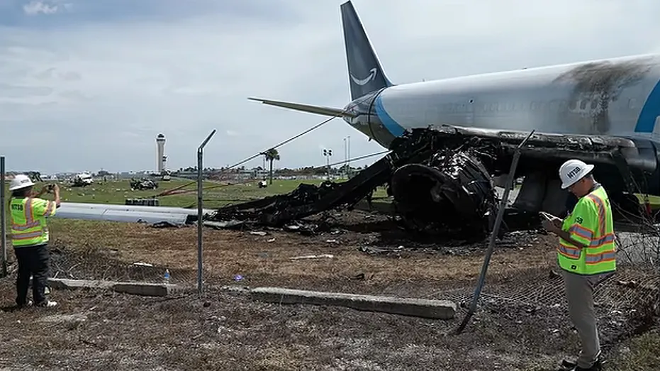 Investigators inspect burned plane wreckage