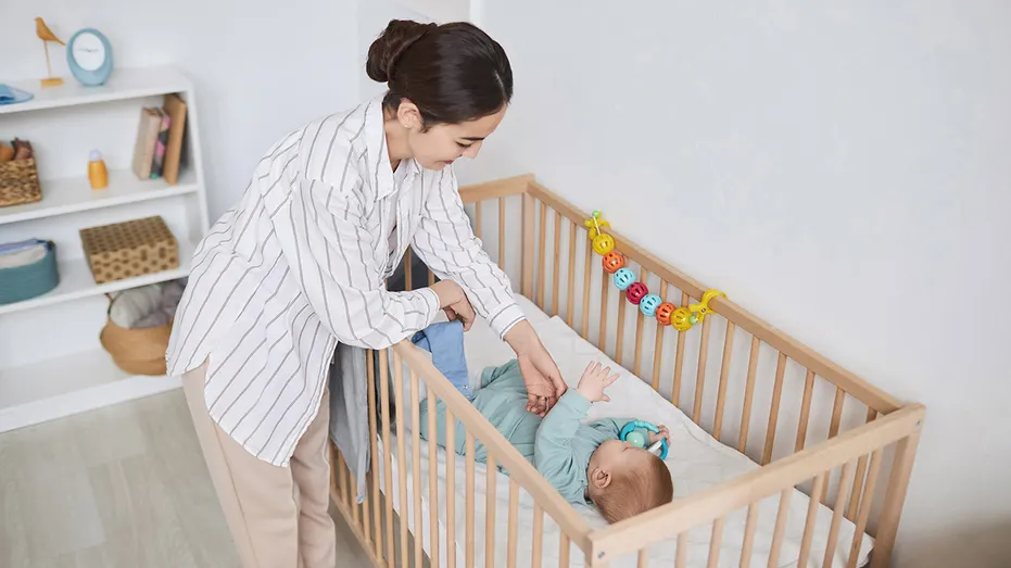 Mom and baby in crib