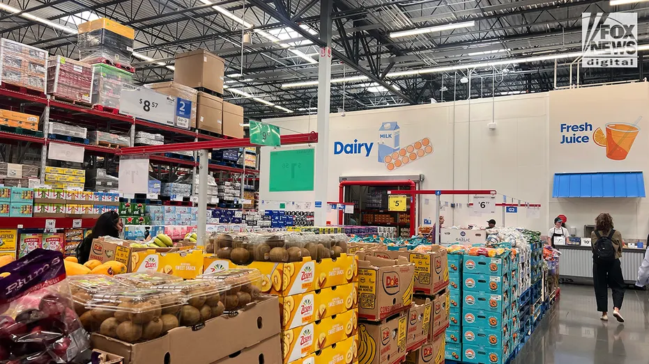 Produce and grocery items are displayed inside a Sam’s Club store